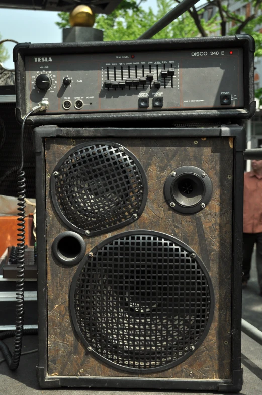 old portable boombox with several large metal plates