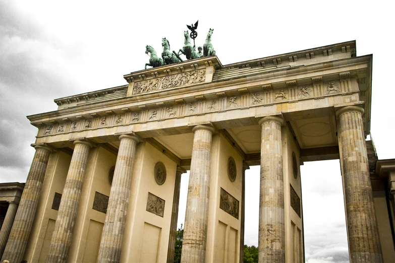 a stone building with columns and statues