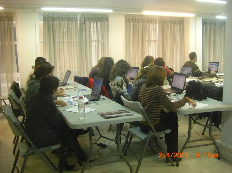 a group of students sitting at computers together