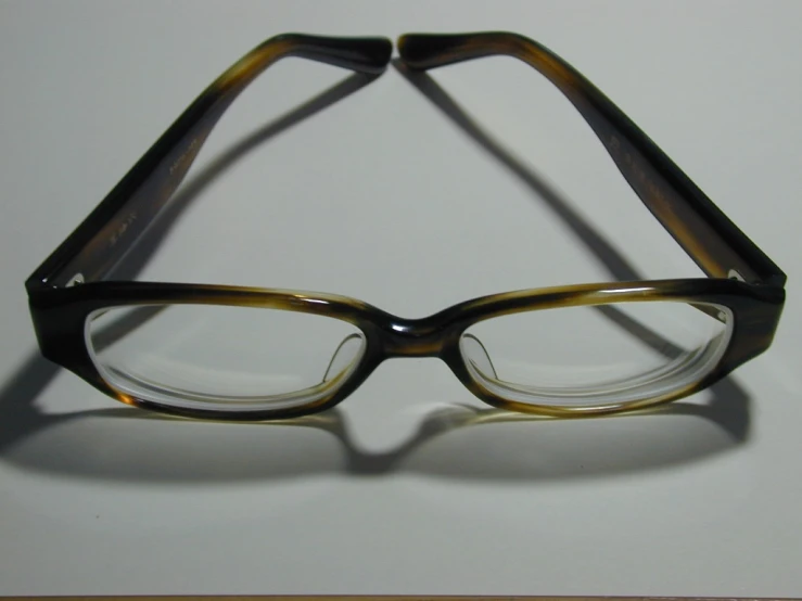 an eyeglass is held upside down on a table