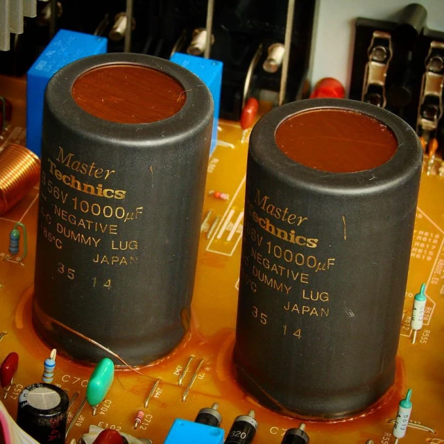 close up of electronic components showing capacitors and wires