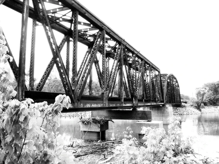 a black and white po of a train bridge