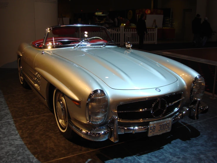 the classic mercedes benz coupe on display at a museum