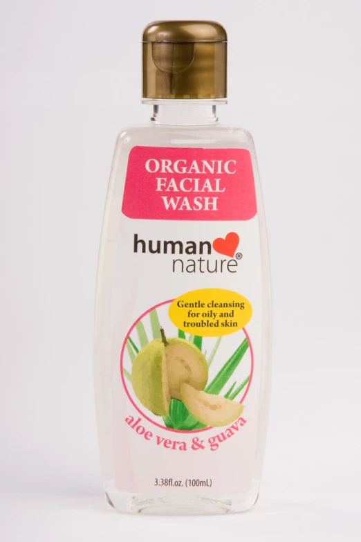 a bottle of organic soap with a yellow cap