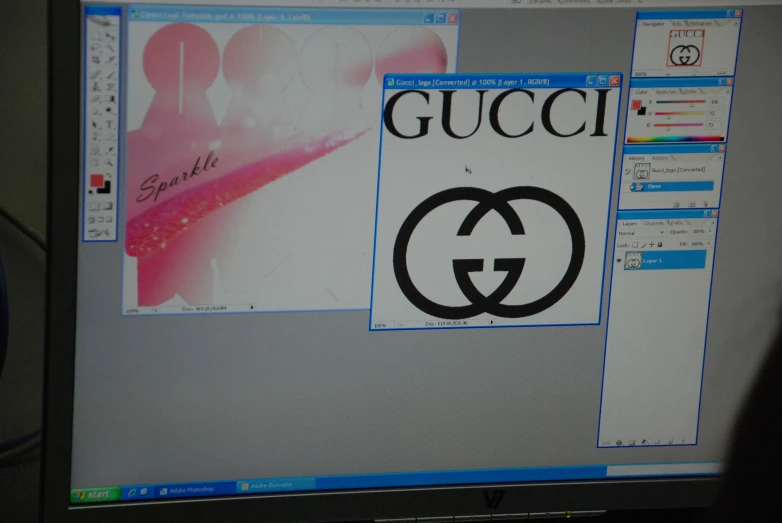 a computer screen with a gucci sticker on it