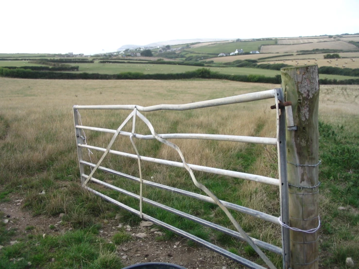 a close s of a fence in a field