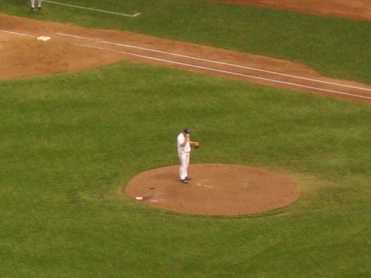 the pitcher is throwing the ball in the field