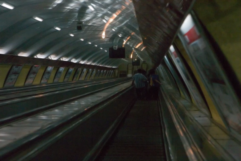 a view of a train in motion from inside of a moving car