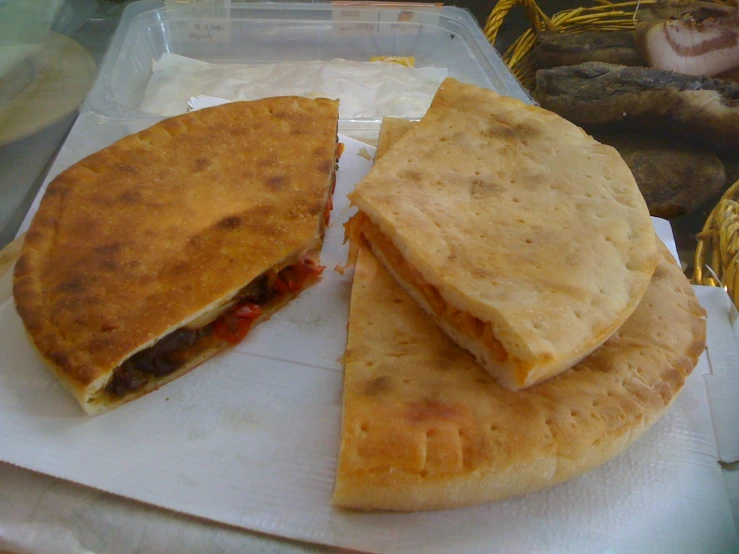 a food entree with pita bread and meat