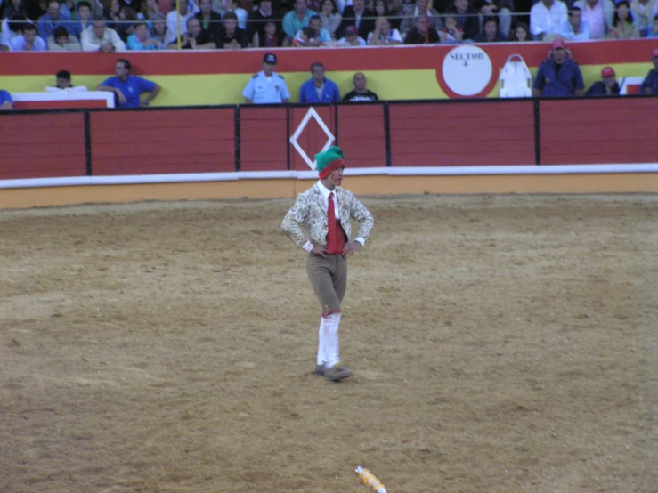 an older man in a red and white sweater doing acrobatic tricks