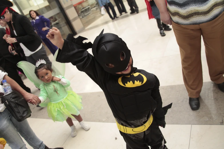 a little girl in costume at a mall