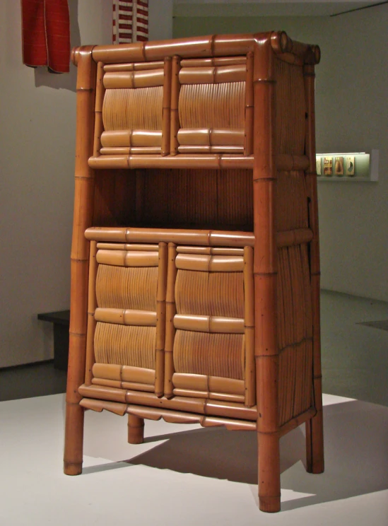 an antique bamboo shelf made from rattan