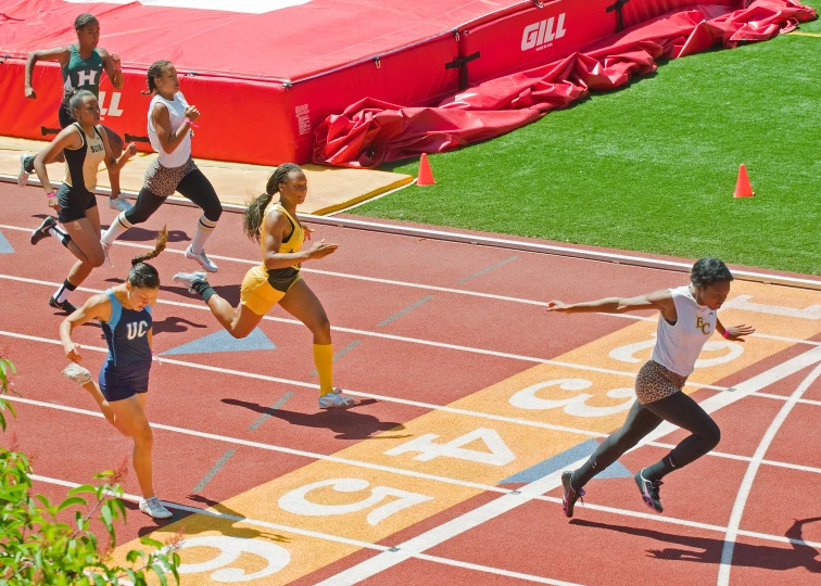 a couple of women on a running track