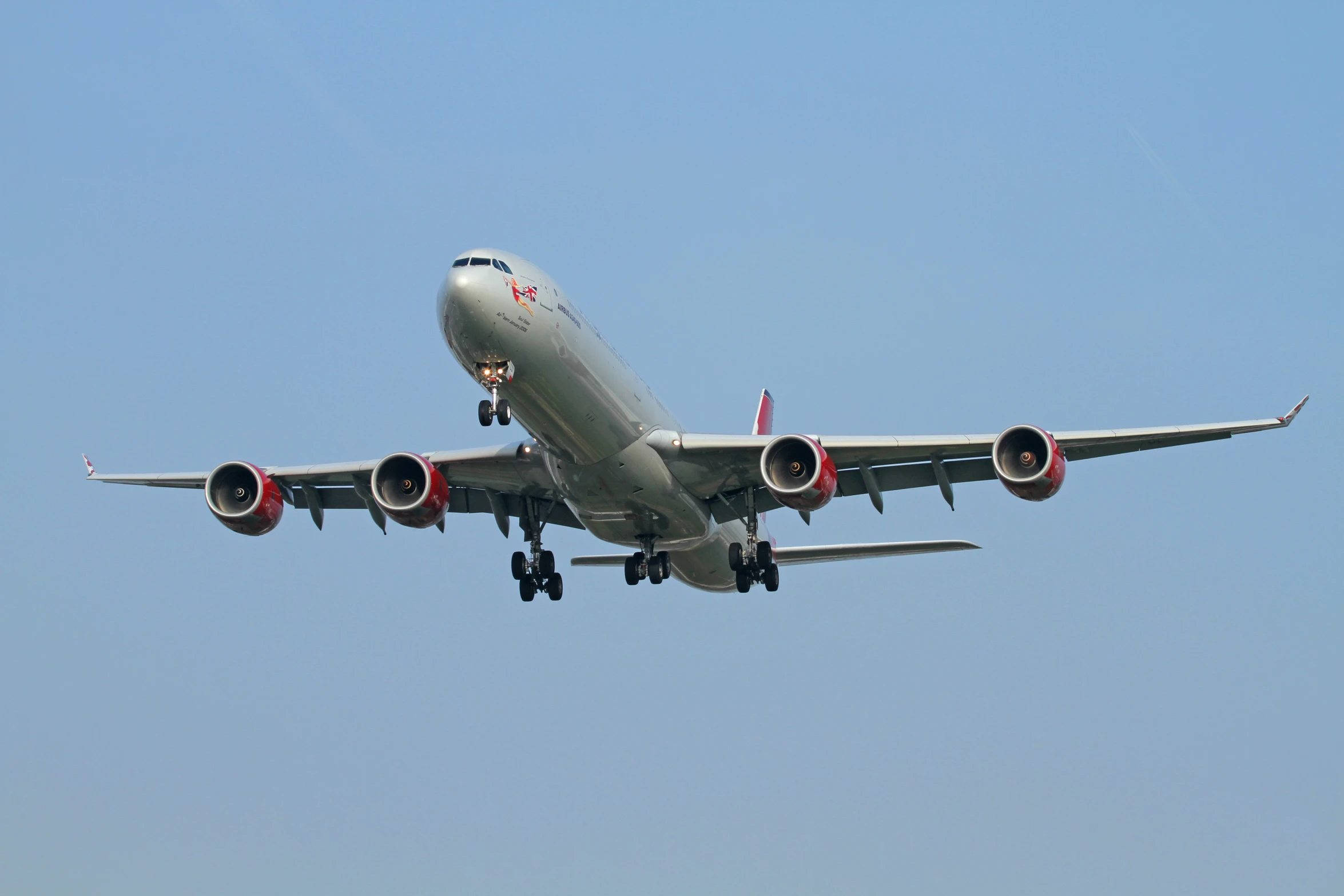 the passenger jet airplane has three engines and is low flying