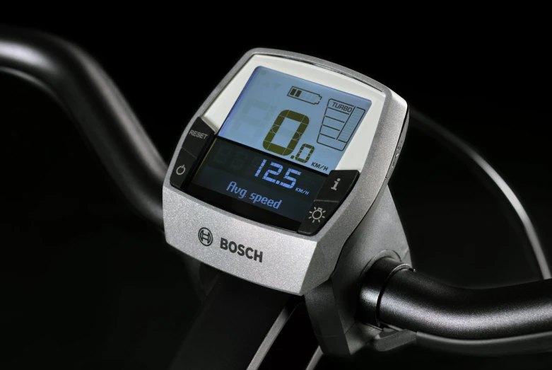 closeup of a bike meter displaying time and speed
