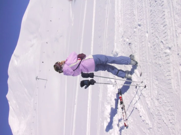 a female in a ski suit on some snow