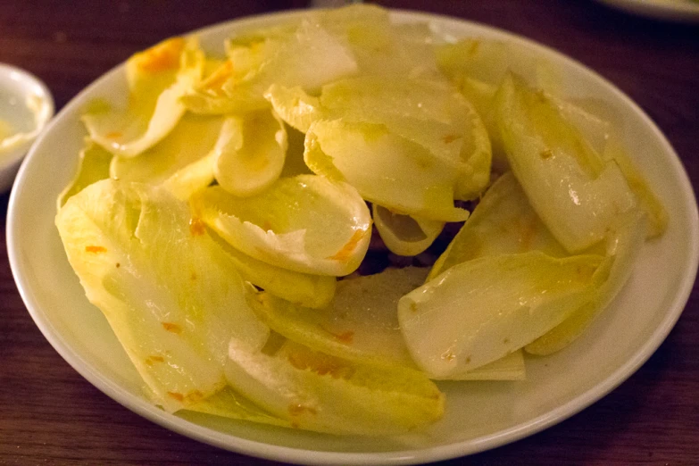 a white plate topped with sliced up onions