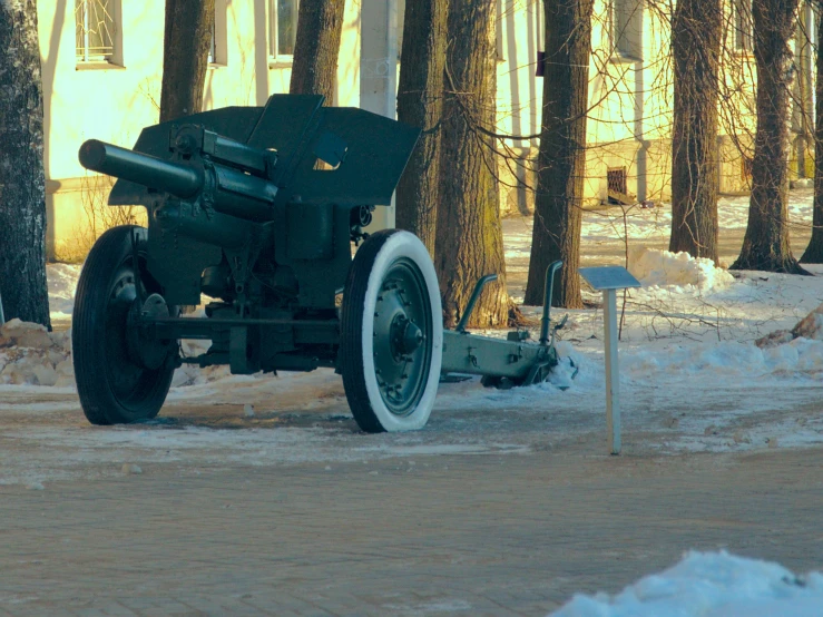 a close up of a large artillery on snow