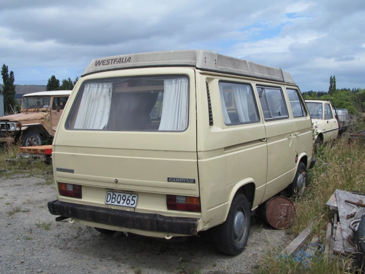 an old van is parked outside of a building