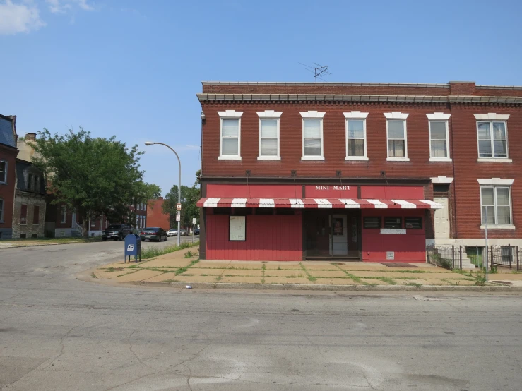 a small red store in a small town area