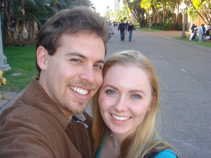 a man and woman standing next to each other