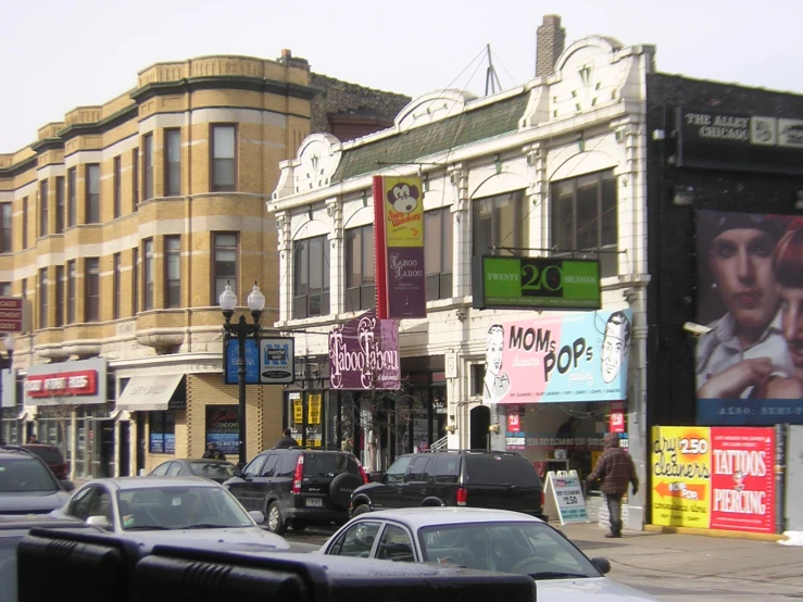 a street scene with several cars driving down it