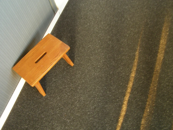 an odd looking foot rest sitting on a rug