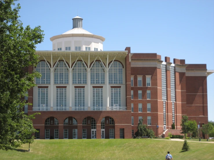 a large building has glass panes that look like windows