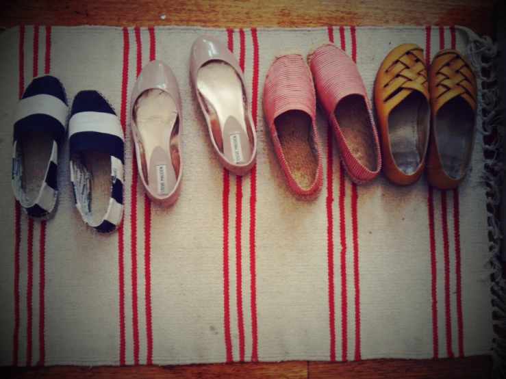 six pairs of ladies's shoes lined up in a row