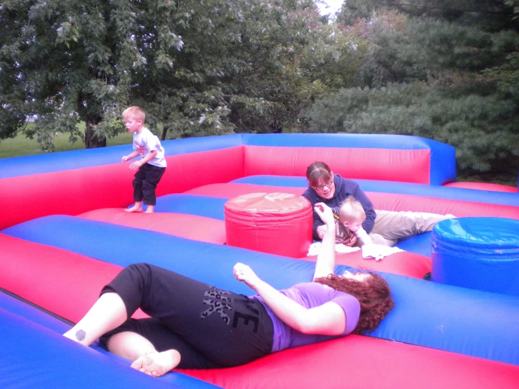 the family plays in the bounce house that has been inflatable