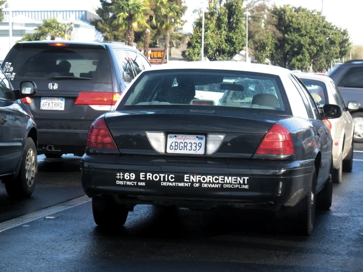 many cars parked on the side of the road near each other