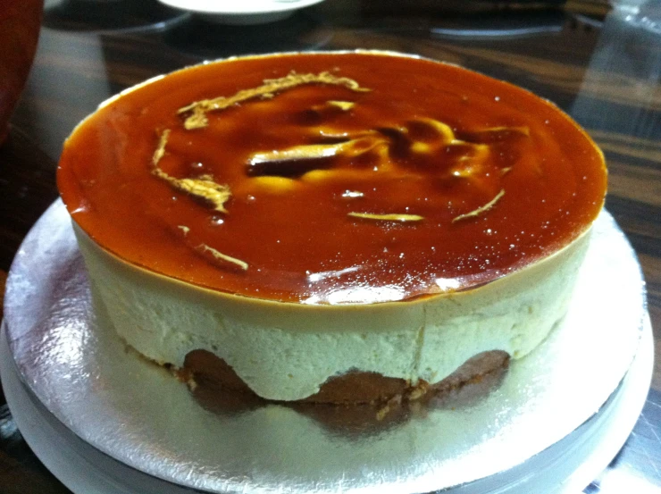 a large chocolate layer cake with gold letters on it