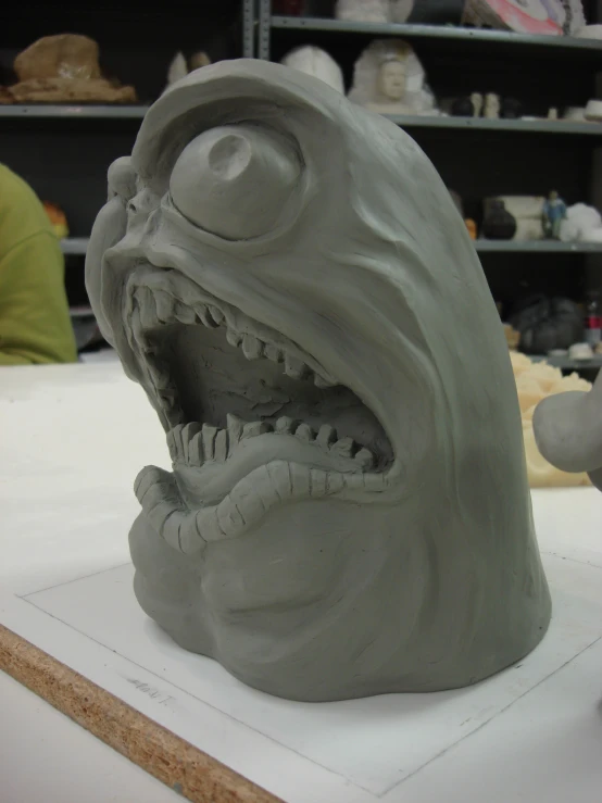 the clay model is showing a large grin