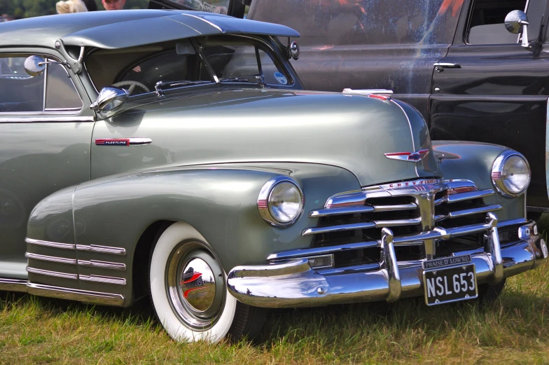 an old vintage pickup truck on display at a car show