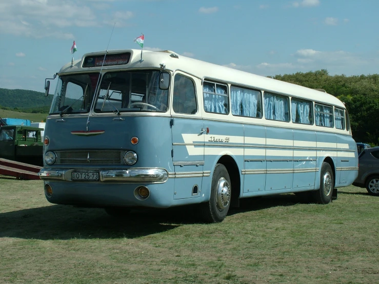 a big bus that is sitting in the grass