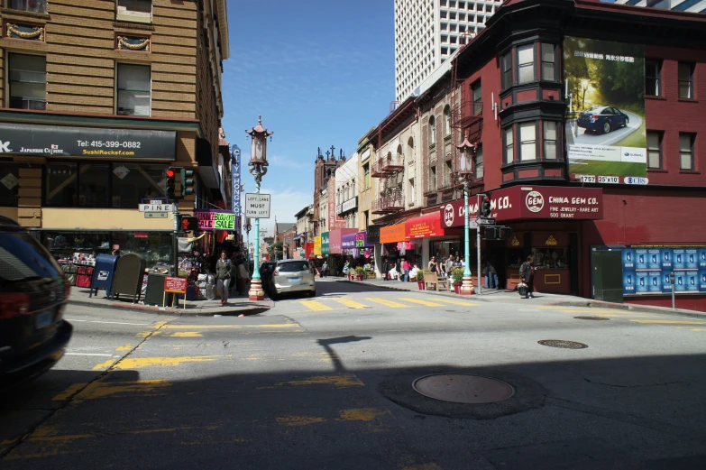 a busy street with shops and businesses on it