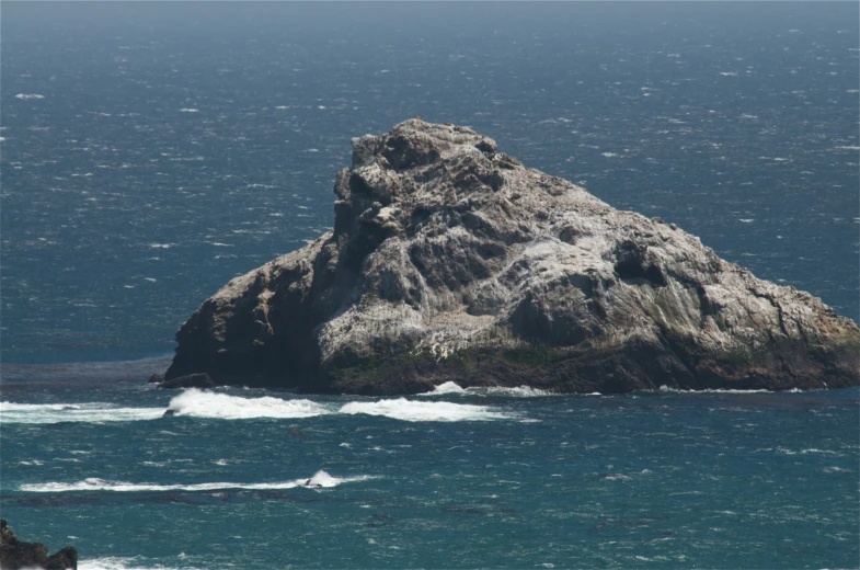 a lone island in the middle of the ocean