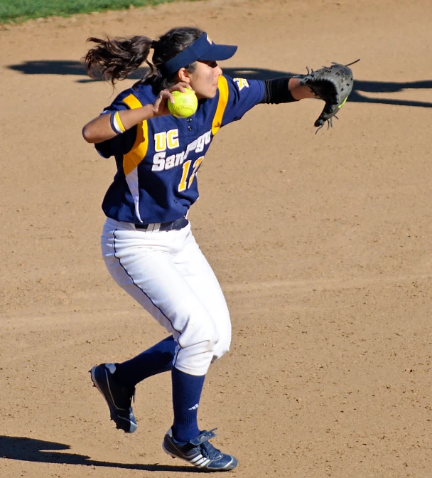 a girl about to catch a ball on the field