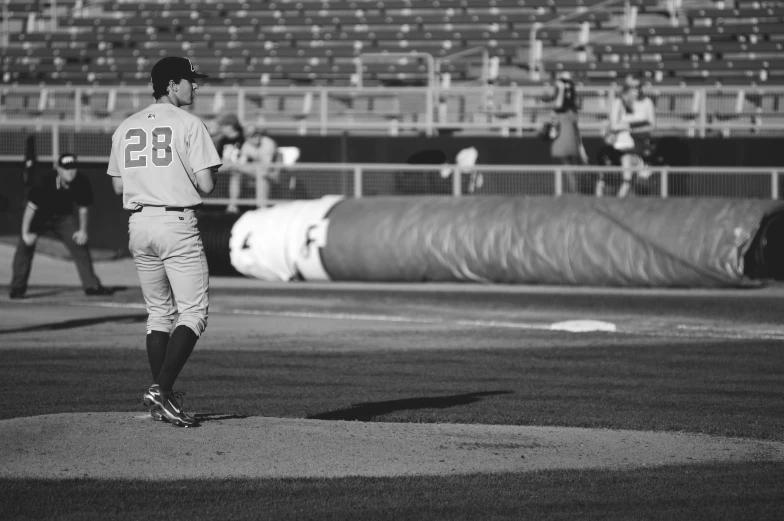 a man standing on top of a baseball field