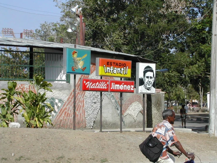 a man carrying a large backpack on a street