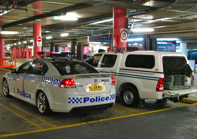 police car being parked in a parking garage