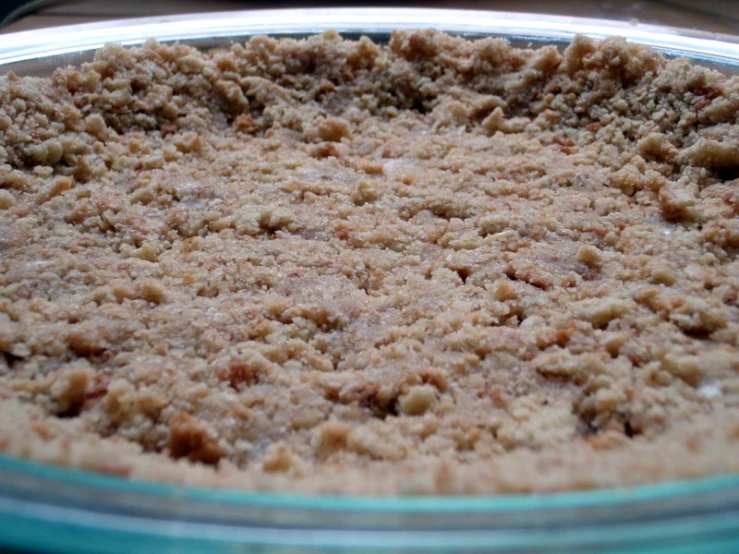 a pie pan filled with food sitting on a table