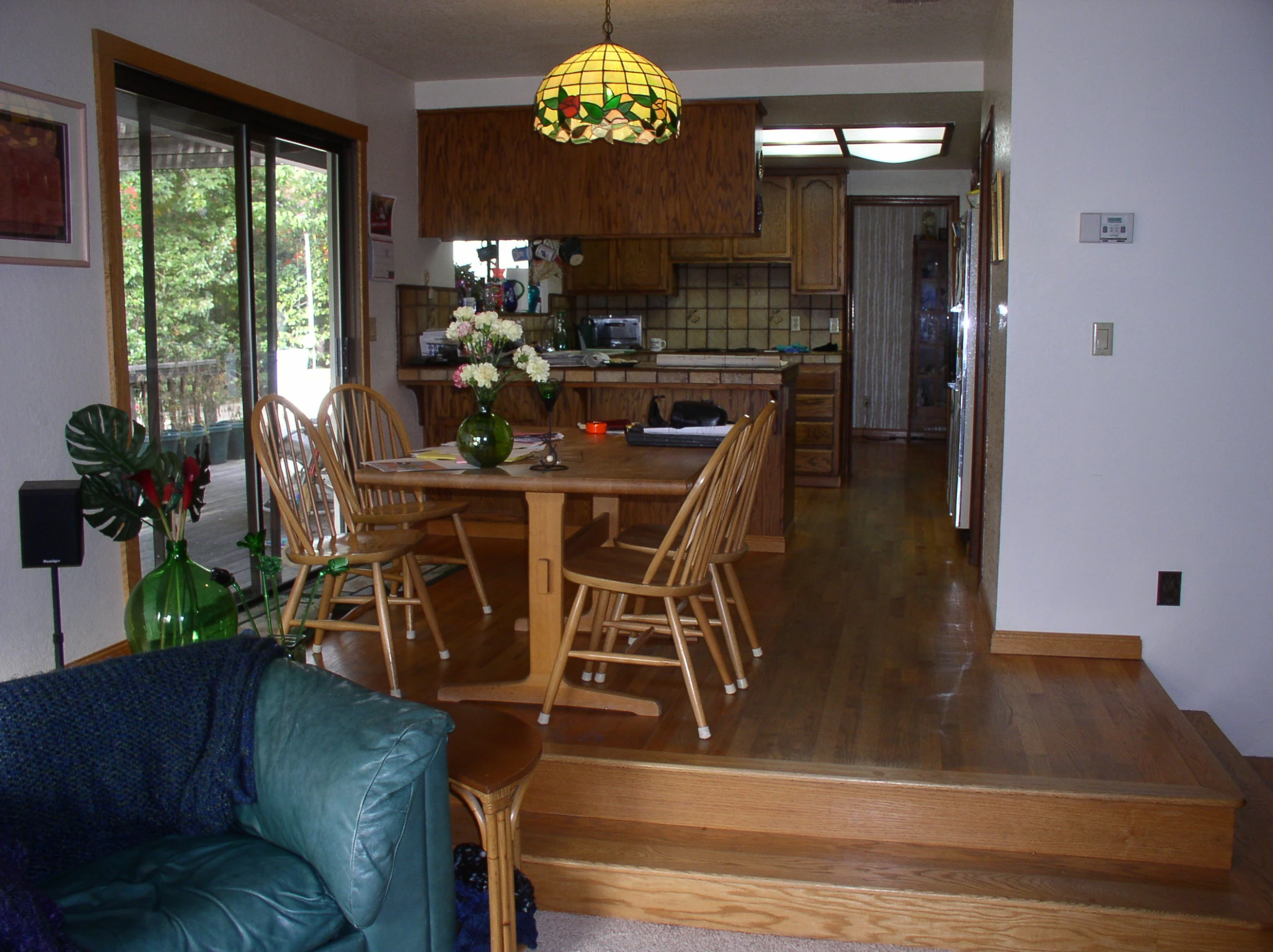 a large open room with a table and some chairs and a couch