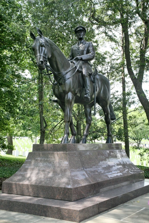 a statue of a person riding on the back of a horse