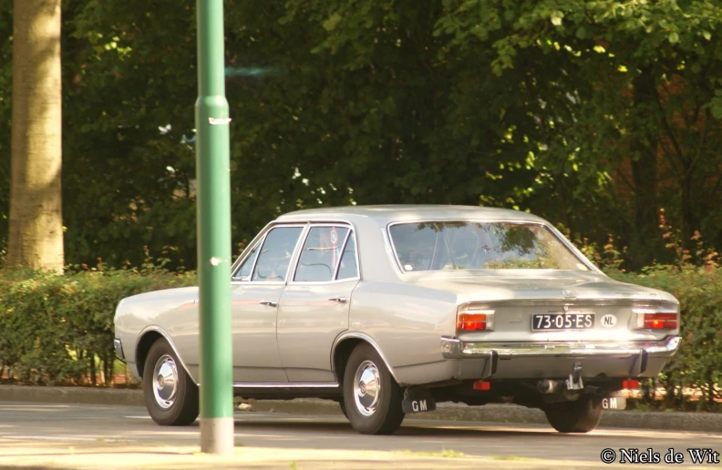 a silver car parked on the side of a road