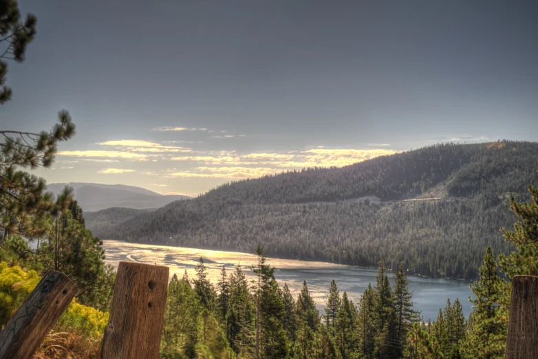 a lake in the mountains, with trees on either side