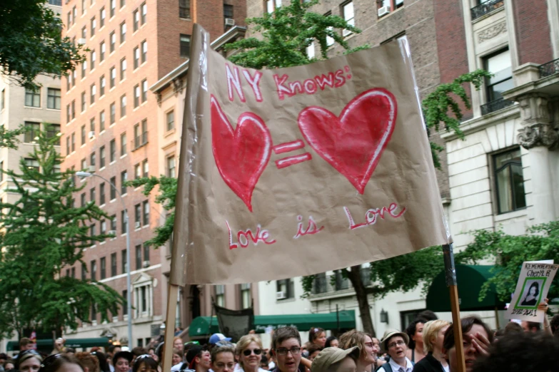 a brown cloth flag with hearts saying'my vows were done by one lucky love letter '