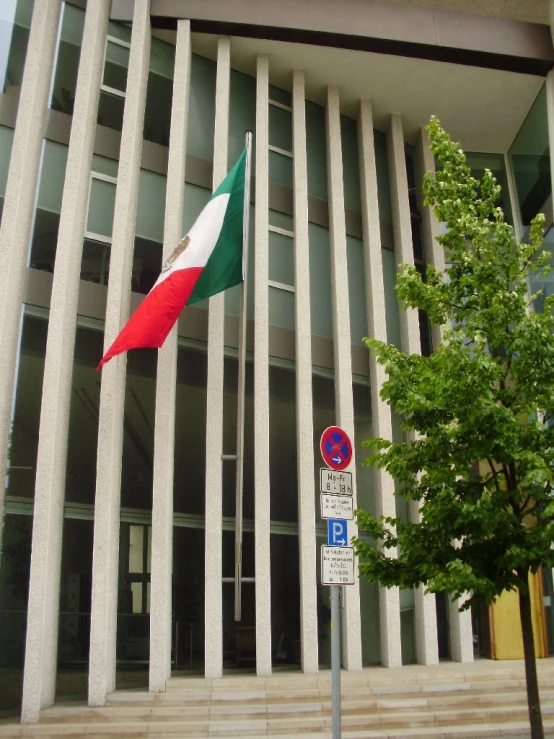 the italian flag flies over the national building in italy