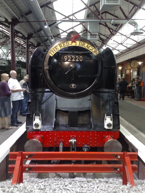 an old steam engine is displayed at the station