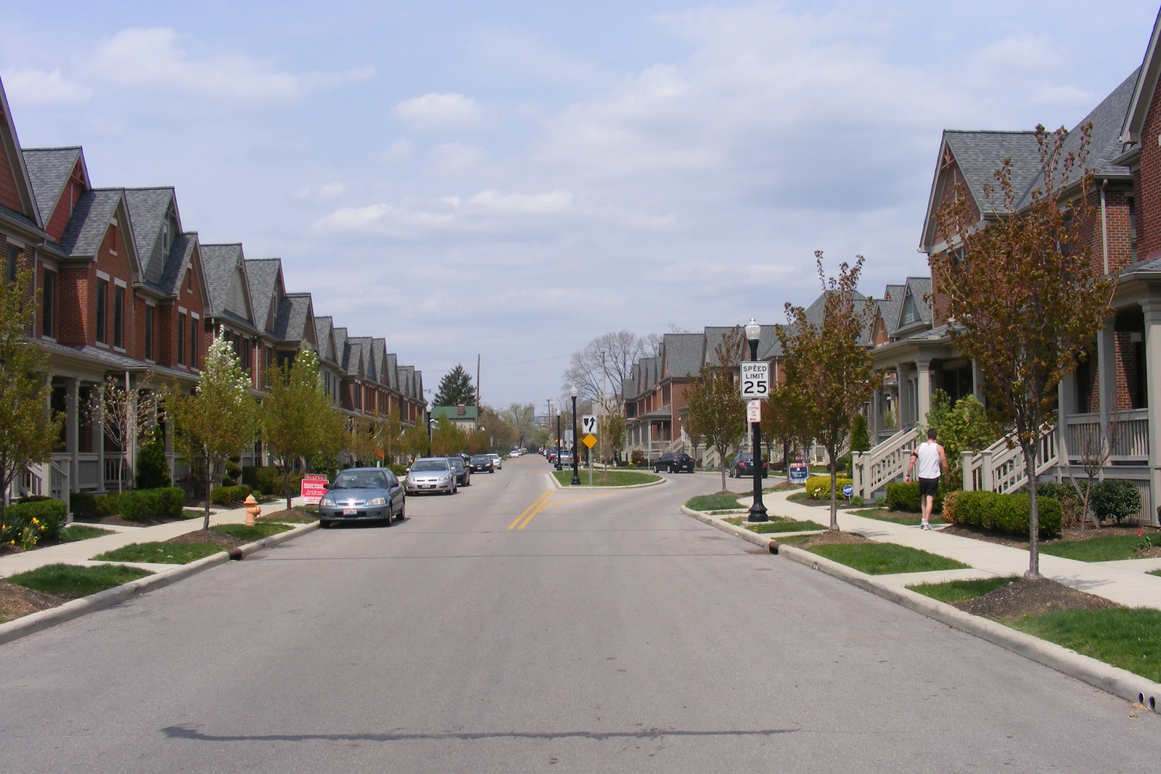 a city street filled with houses next to each other